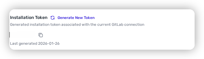 The Add Gitlab Organization modal after saving, showing the generated Installation Token with a copy control.